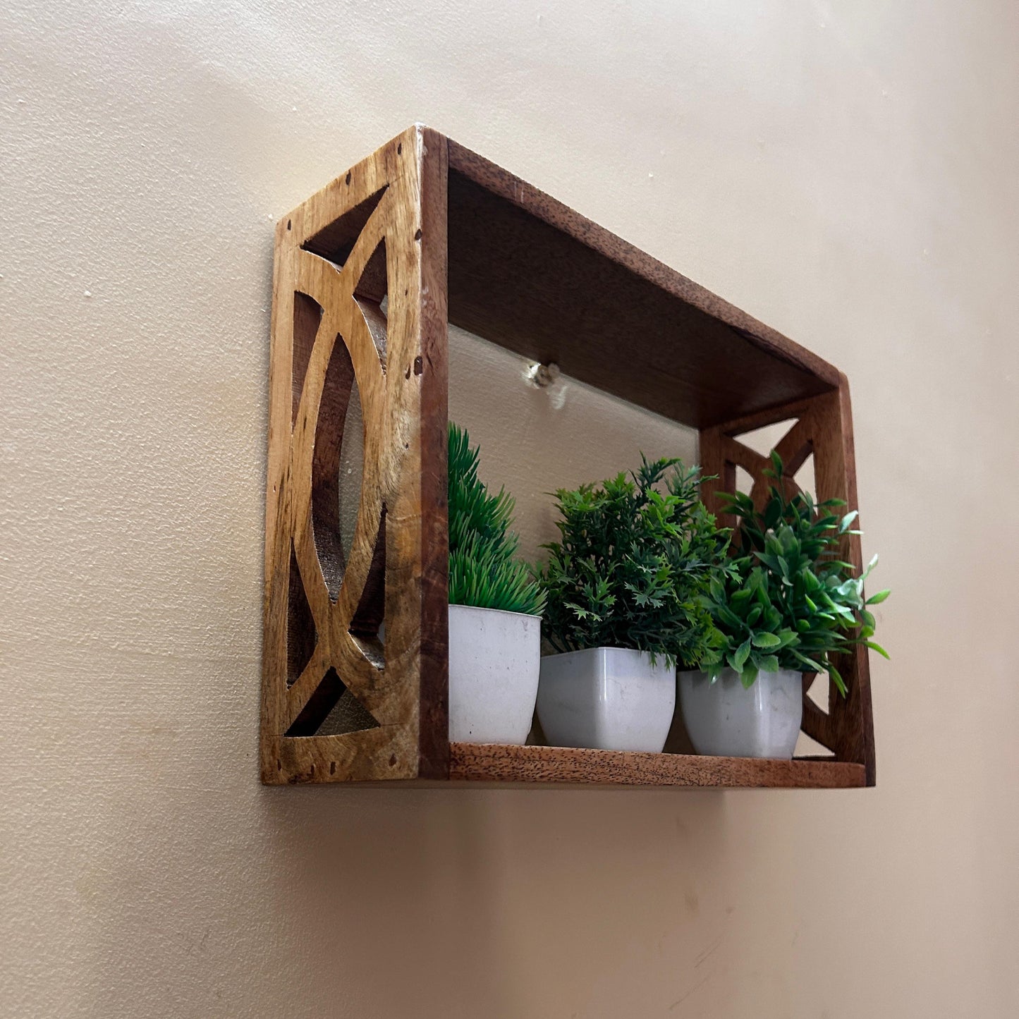 Handcrafted Wooden Wall Shelf with Intricate Cutout Design
