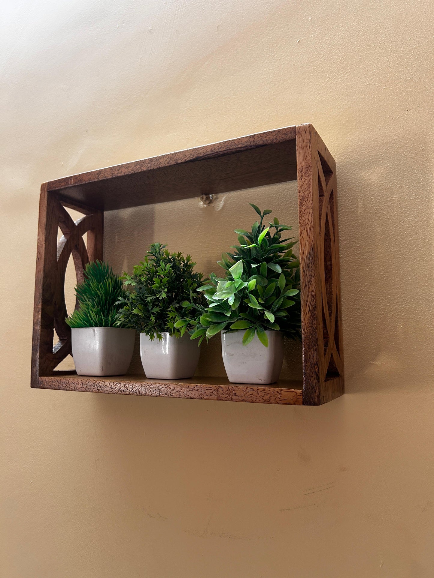 Handcrafted Wooden Wall Shelf with Intricate Cutout Design