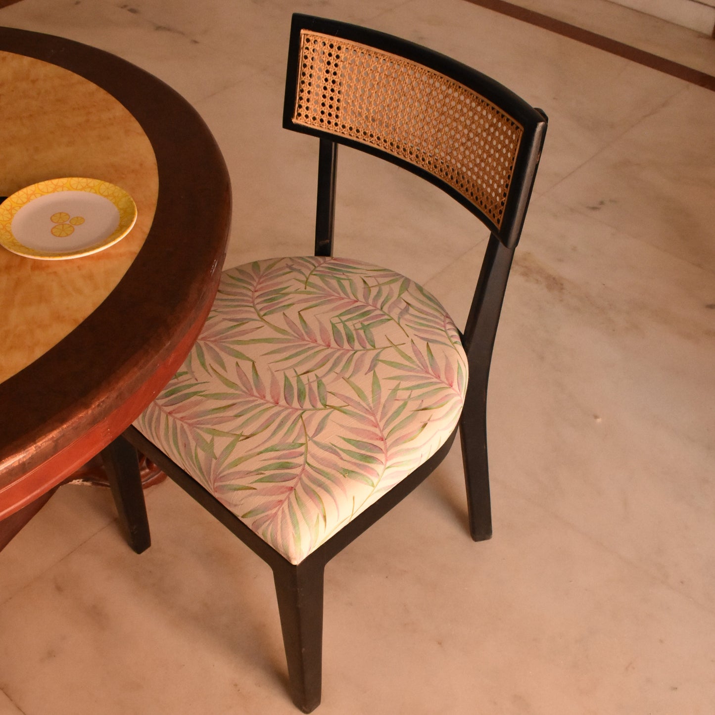 Elegant Black Cane Dining Chair with Tropical Upholstery