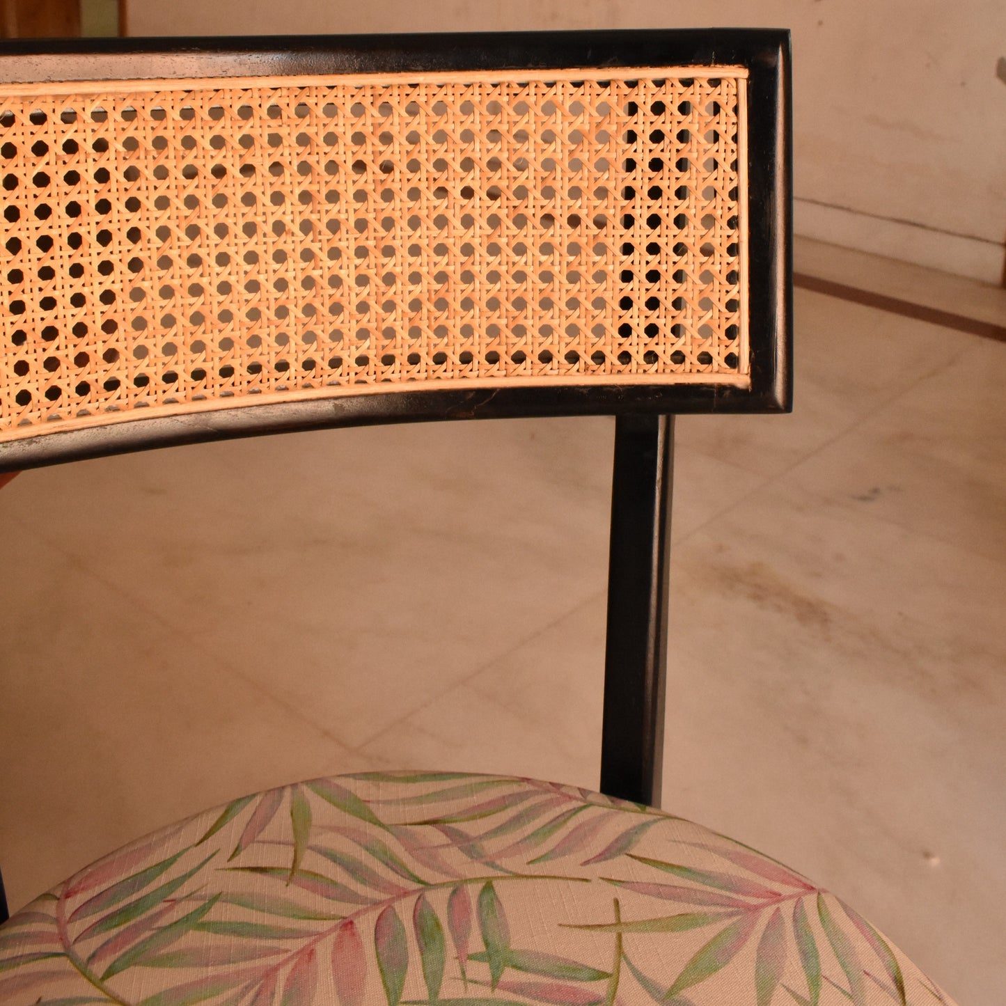 Elegant Black Cane Dining Chair with Tropical Upholstery